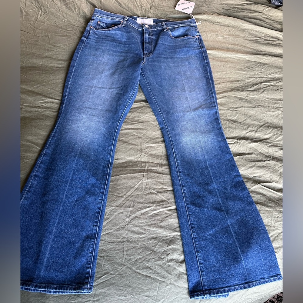 New with tags, Mother “The Weekender” flare jeans in “It’s a Small World” wash.